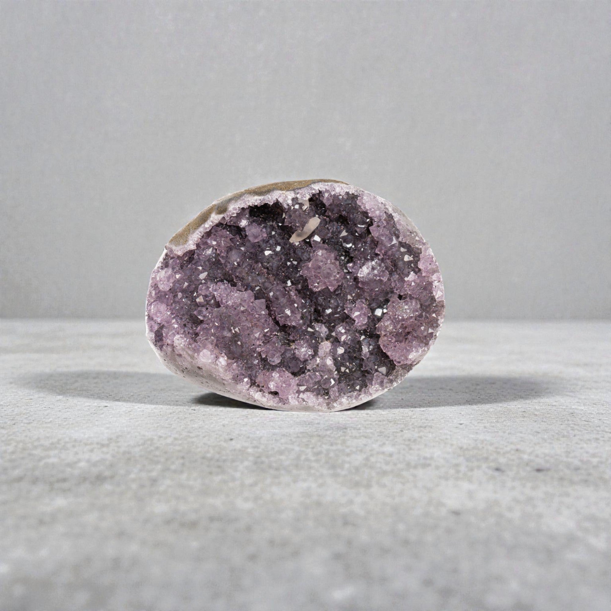 Mini amethyst geode with violet druzy quartz crystals with compact oval cavity - 1.36