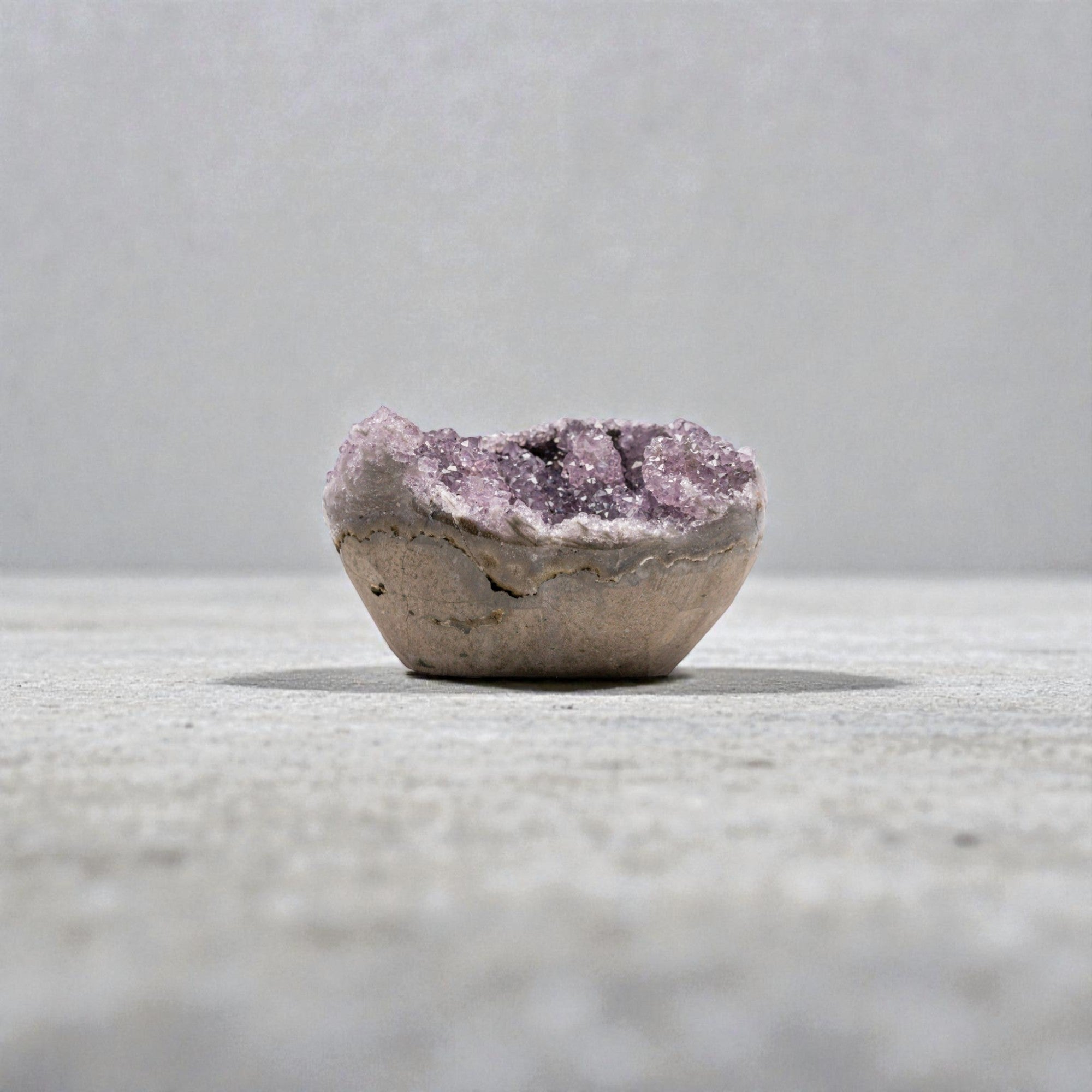 Mini amethyst geode with violet druzy quartz crystals with compact oval cavity - 1.36