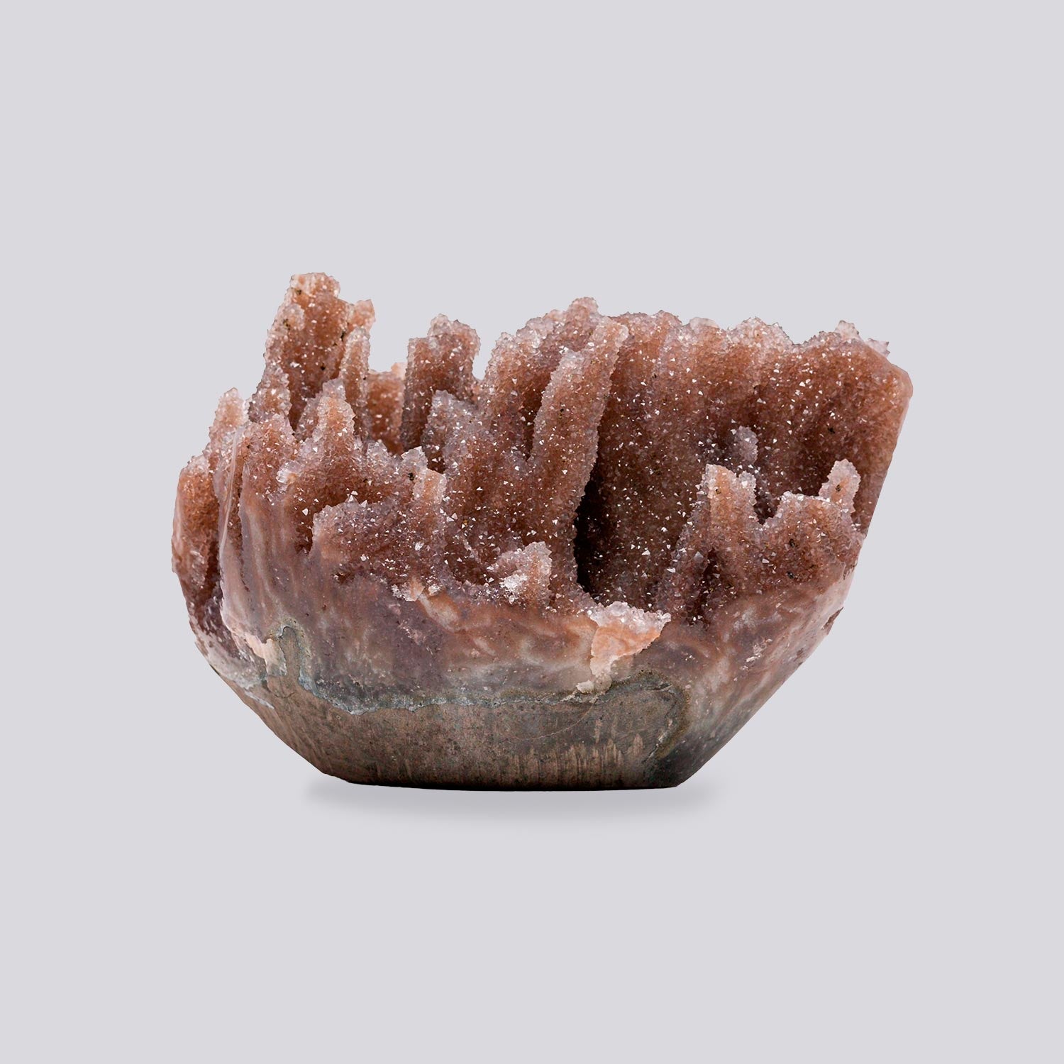 Mini pink druzy quartz geode with coral-toned crystal ridges, chalcedony base, and sculptural volcanic mineral formation.