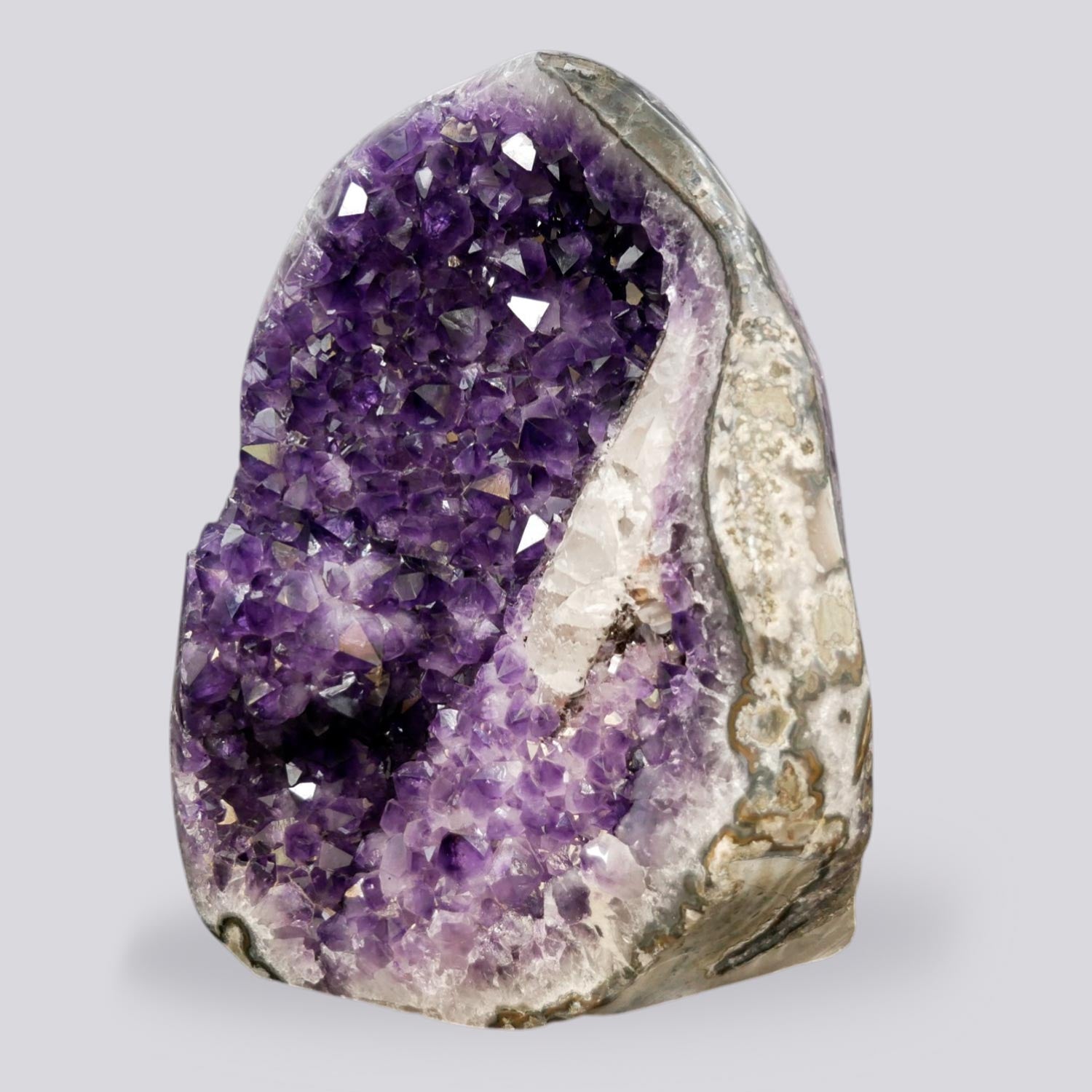 Deep purple amethyst cluster 33.95 lb AAA grade, natural open formation with white quartz border, ethically sourced from Artigas Uruguay, self-standing on wooden table