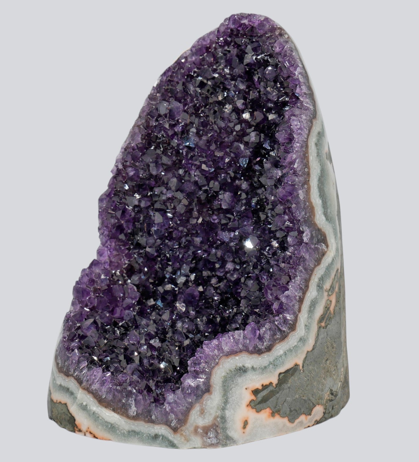 XL amethyst crystal cluster category featuring large 12–15 lb Uruguayan amethyst specimens with deep purple druzy interiors and natural banded agate bases.
