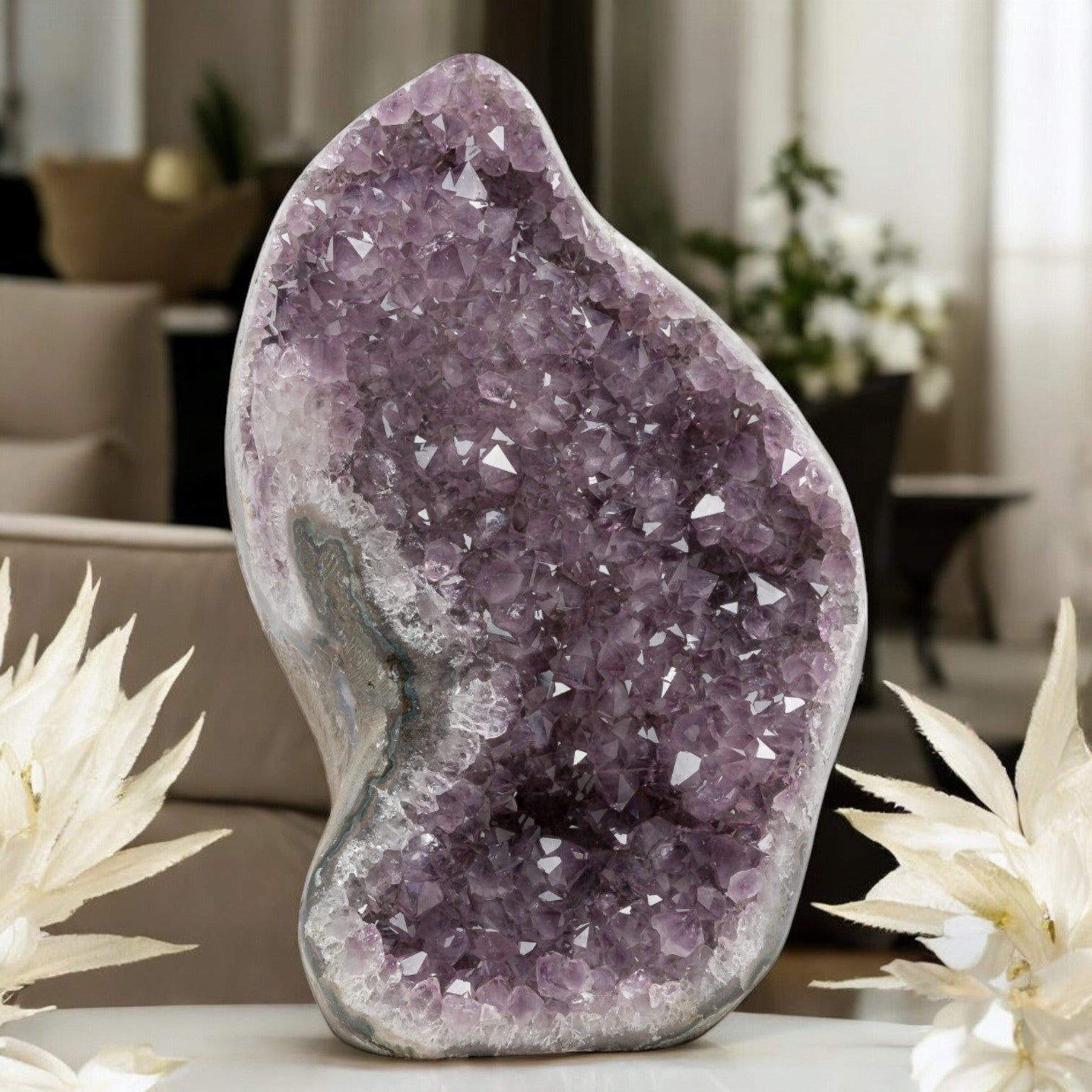 Sculptural amethyst crystal formation featuring pale violet points, curved geode contours, and natural agate-quartz layering.