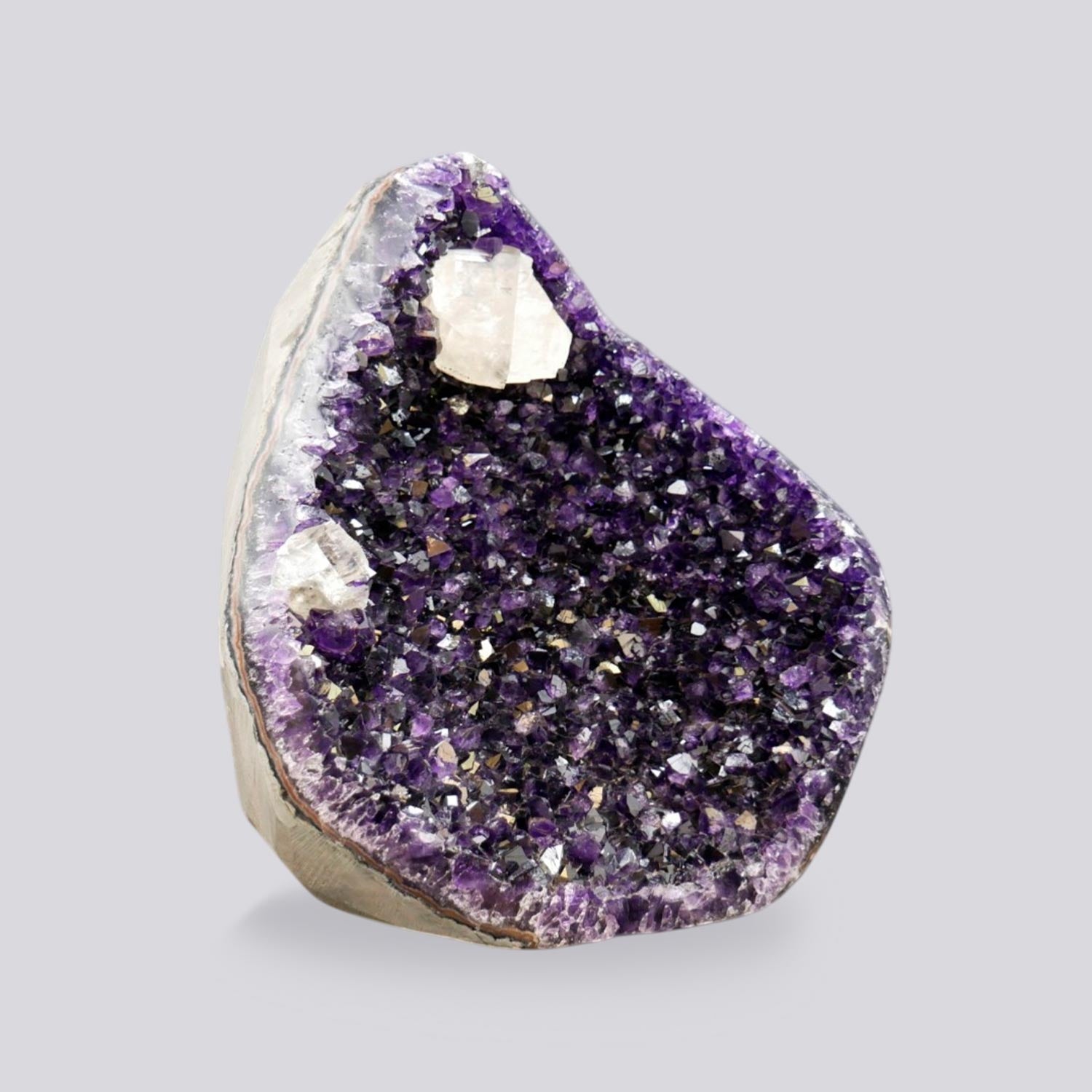 A deep purple amethyst geode from Artigas, Uruguay, 16 lb of AAA-grade Uruguayan amethyst with natural calcite inclusions, dark violet saturation, and the geological character that defines a true large amethyst geode. One of a kind. No restock.