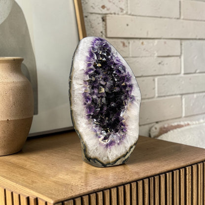 The deep purple saturation is characteristic of Uruguayan amethyst — denser and richer in color than Brazilian material, with tightly packed crystal points that catch and hold light from every angle.