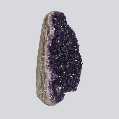 Upright amethyst geode featuring rich purple crystals and multitone agate layers, approximately 11 × 7 × 4 inches in size.
