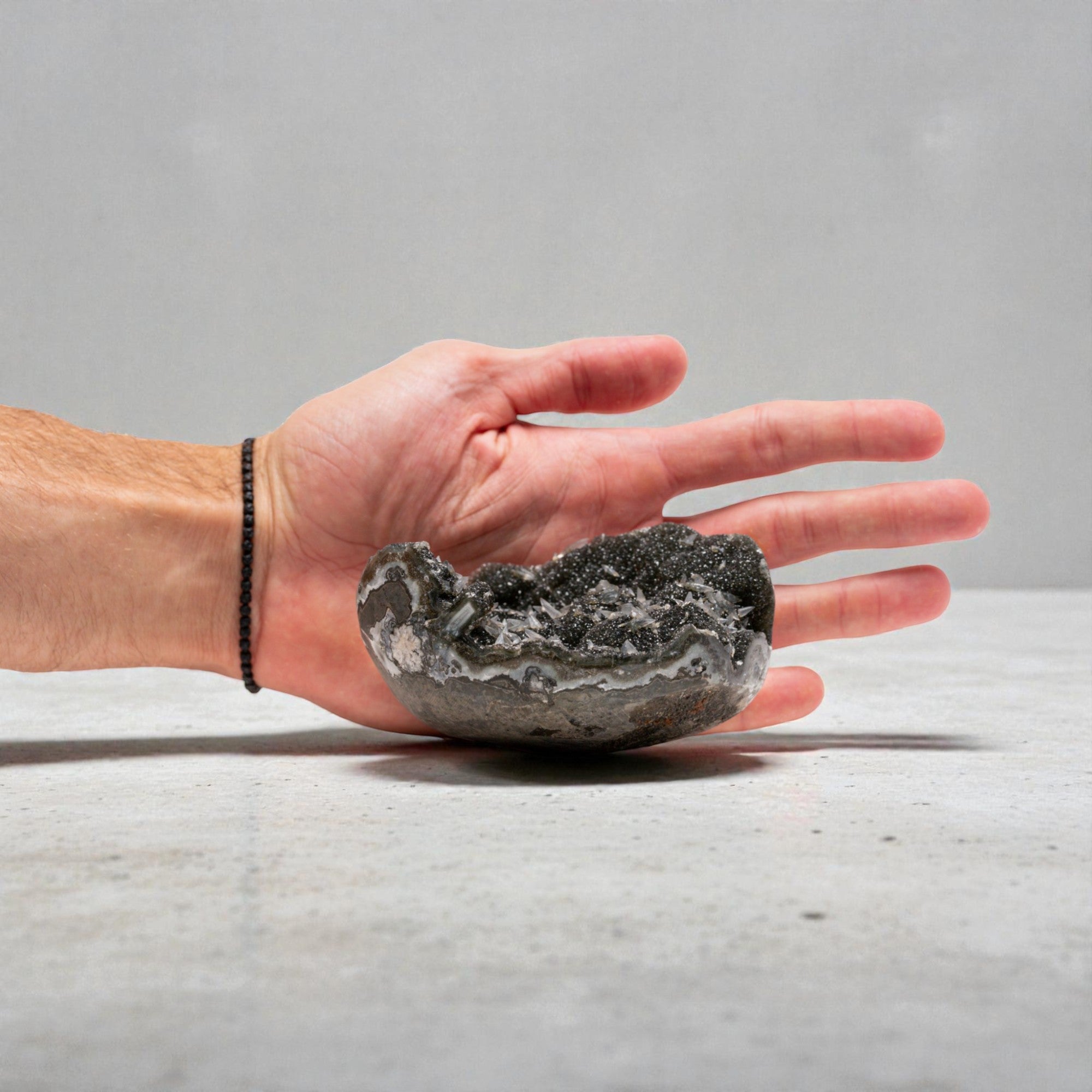 mini druzy quartz geode with strong agate banding, dark micro-crystal interior, chalcedony layers, sculptural bowl shape