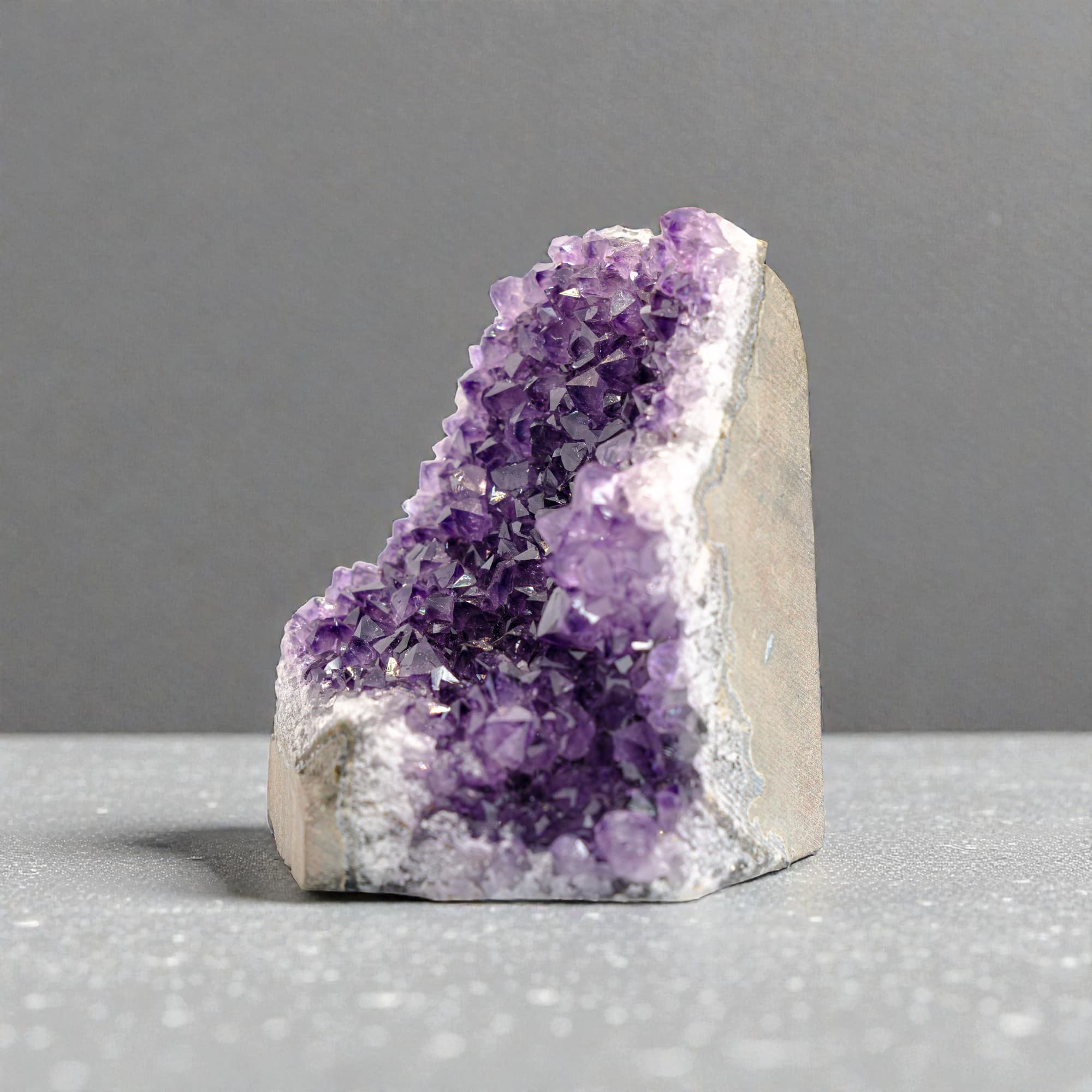 This premium AAA grade Uruguayan amethyst cluster (4-5 lb) carries the glow of natural crystals from Uruguay with exceptional color depth and clarity. 4.5" to 9" H
