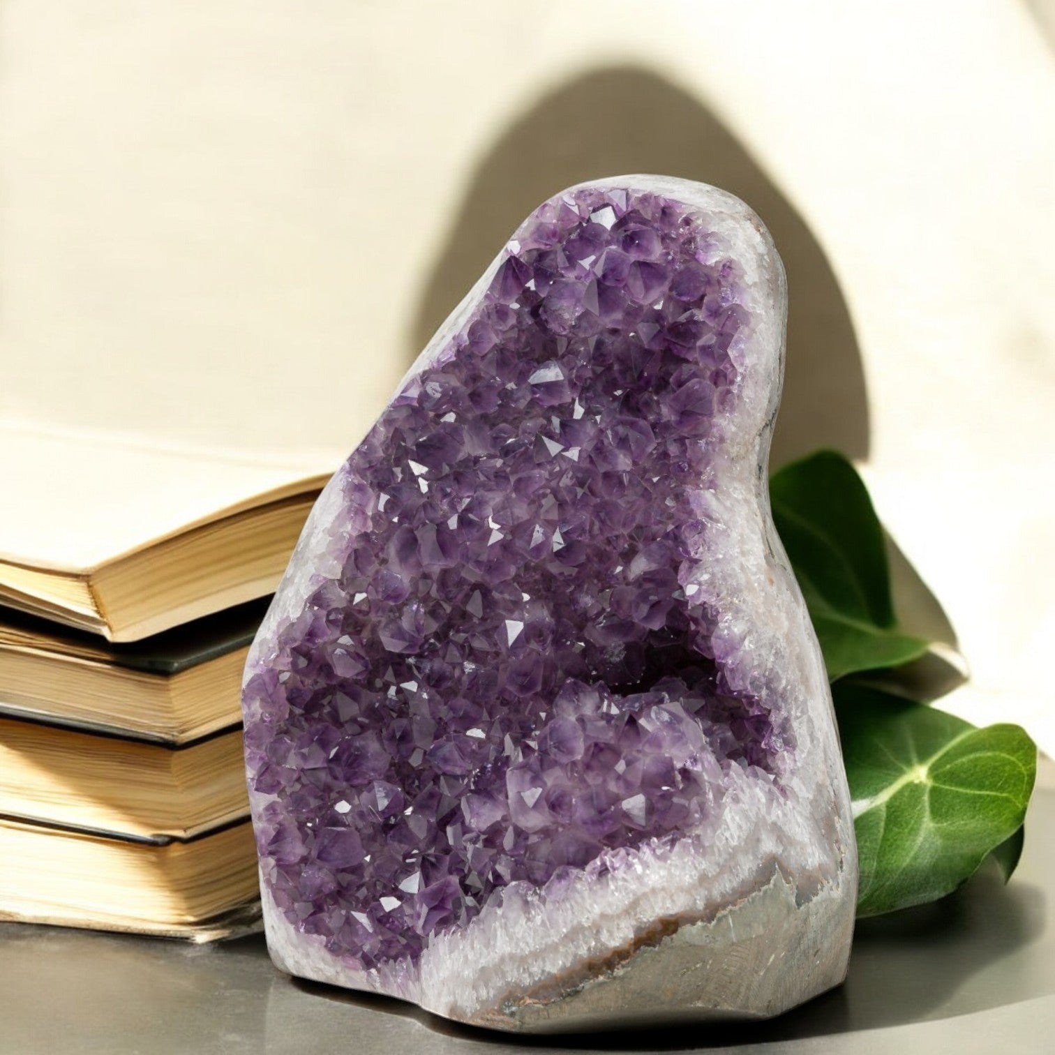 Hand-selected Uruguayan amethyst geode displaying vibrant purple crystals and white quartz edges, ideal for luxury home decor or altar styling.