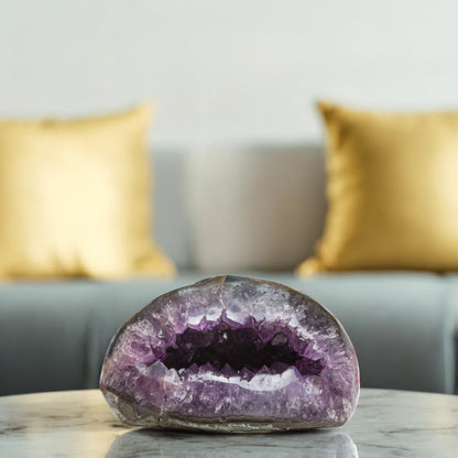 Uruguayan amethyst geode with a deep hollow core and lavender crystal edges. AAA Raw.